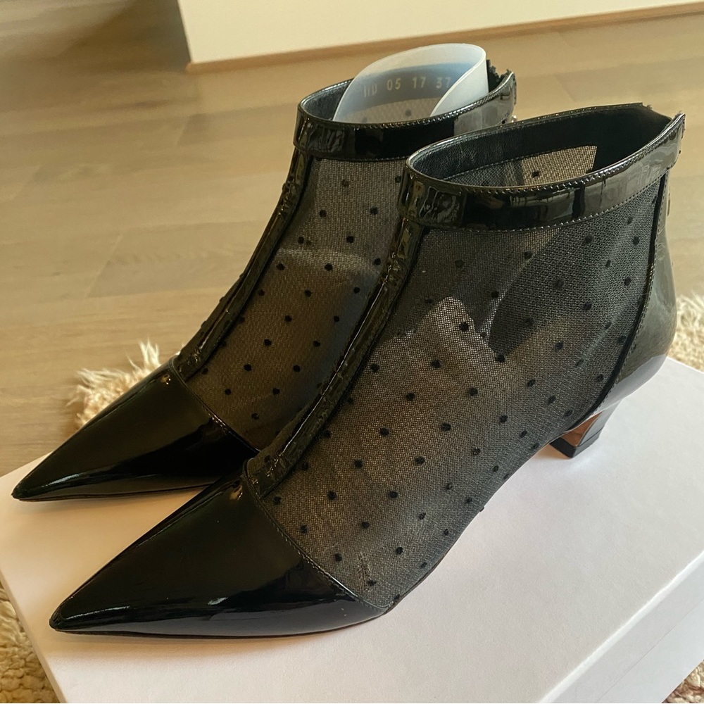 Dior Pretty has a 50mm signature heel, a pointed toe, and a zip at the back.